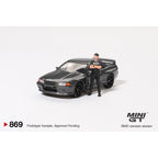 *EN CAMINO* Mini GT Nissan Skyline GT-R (R32) Gunmetal W/ Matsuda Figure - 869